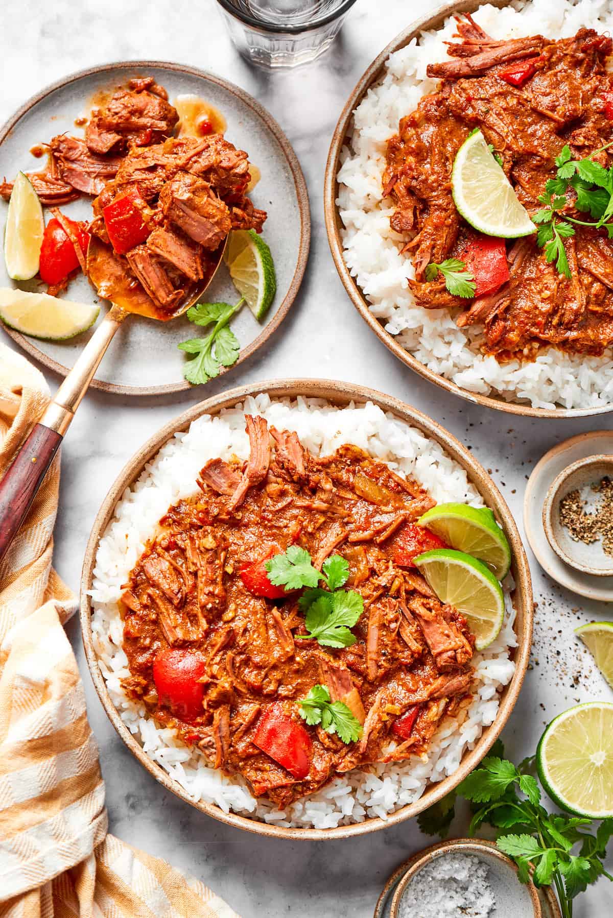 With fall-apart tender beef, fragrant spices, and a creamy coconut broth, this easy Slow Cooker Beef Curry is even better than takeout! Overhead view of slow cooker beef curry served in bowl with rice