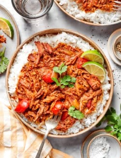 Overhead view of slow cooker beef curry in bowl with rice
