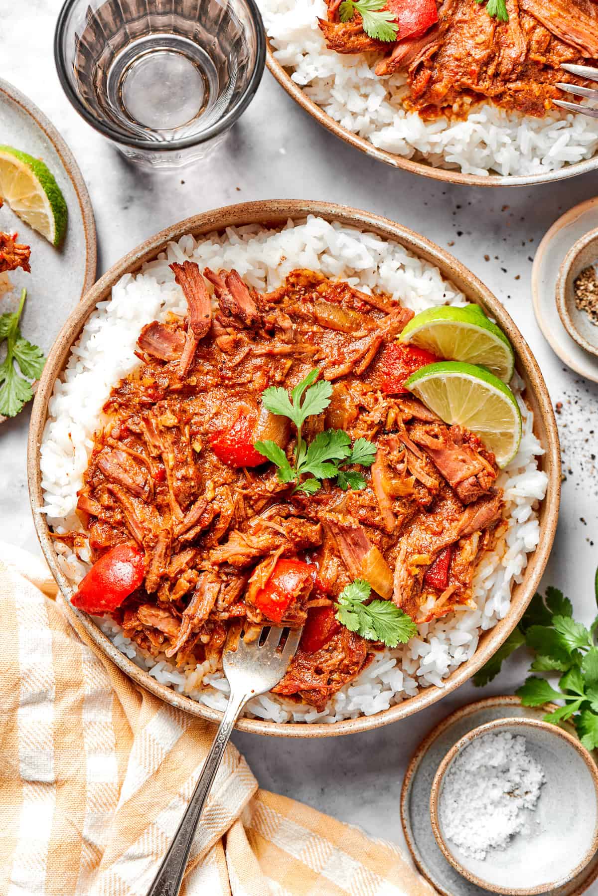 With fall-apart tender beef, fragrant spices, and a creamy coconut broth, this easy Slow Cooker Beef Curry is even better than takeout! Overhead view of slow cooker beef curry in bowl with rice
