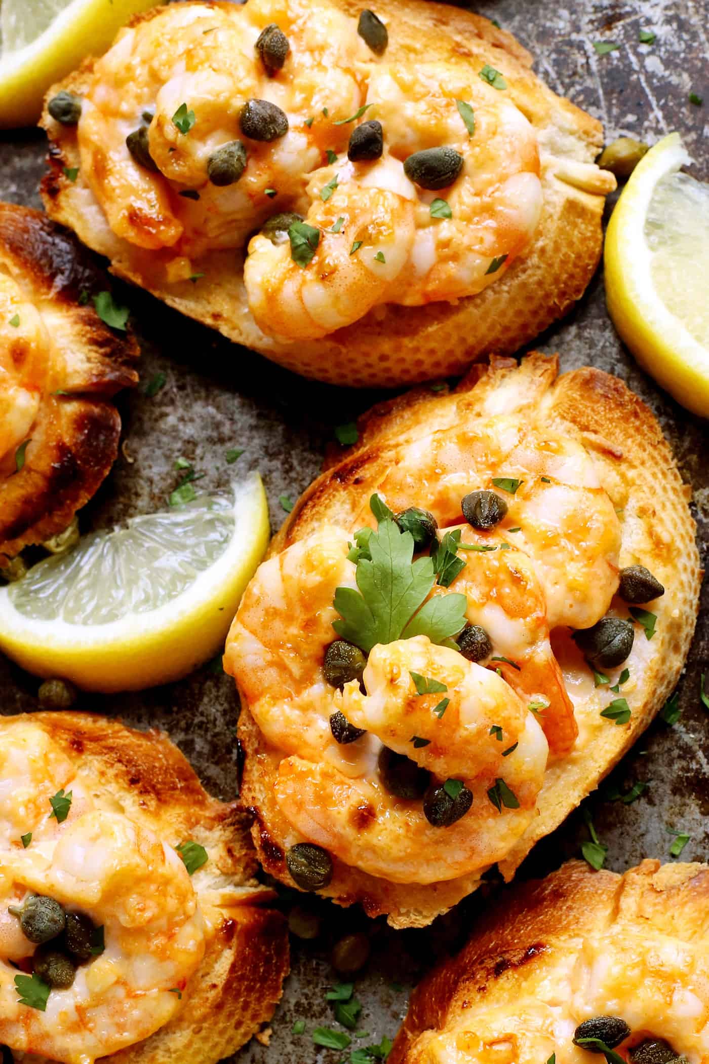 Sriracha garlic shrimp toast is made with tender shrimp, spicy sriracha mayo, and lightly crispy toast! An easy appetizer or light meal. Overhead view of shrimp garlic toast.