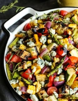 Grilled vegetable salad with blue cheese in pan