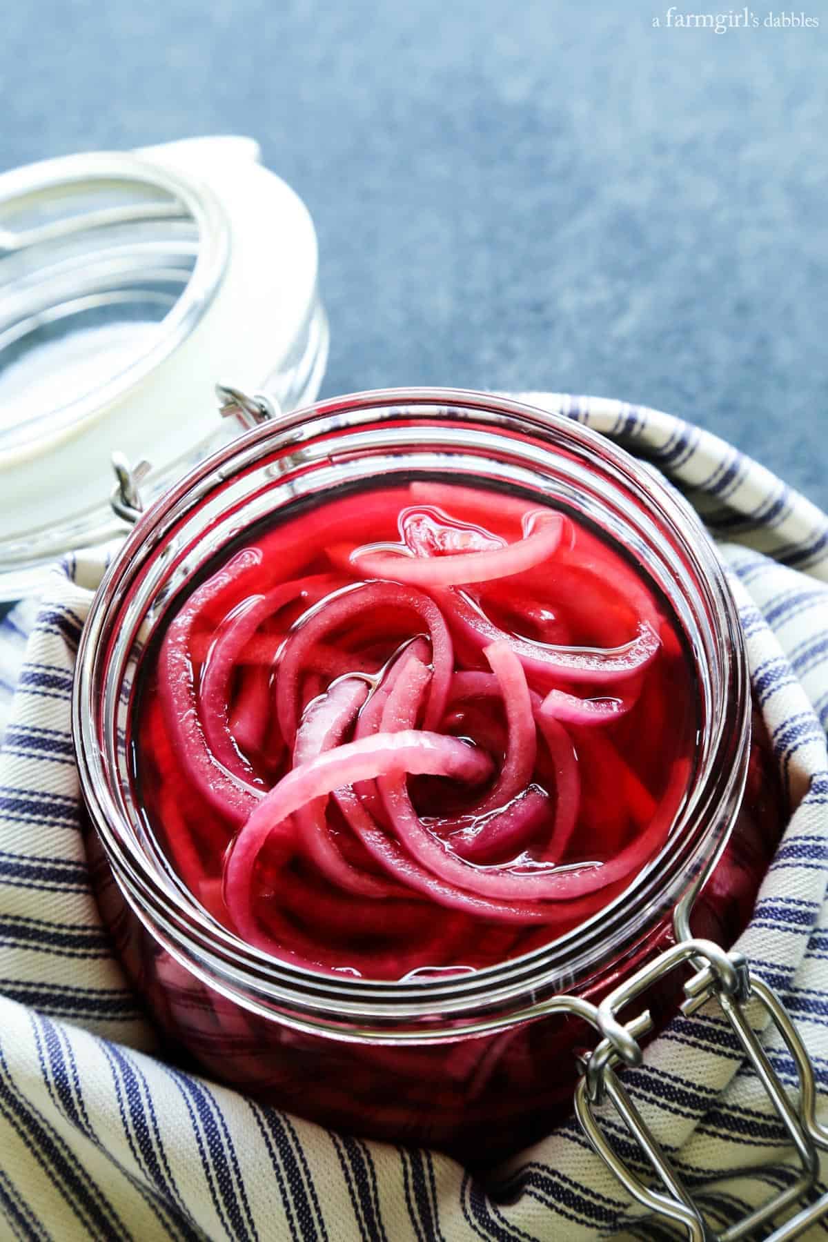This quick pickled red onions recipe is so good! This is the easiest and most flavorful way to make pickled red onions in the fridge. a jar of pickled red onions