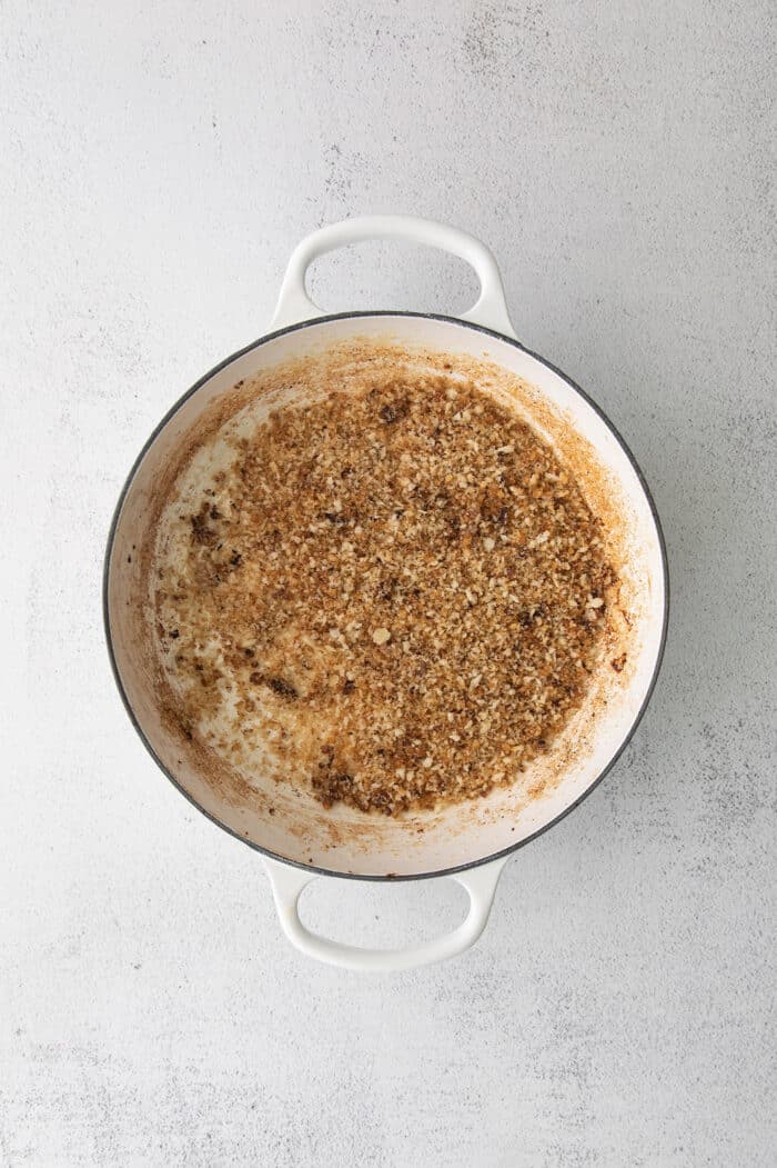 This savory dressing with mushrooms, pork sausage, crispy garlic breadcrumbs, and Parmesan is the best Thanksgiving stuffing recipe! Breadcrumbs in a dish