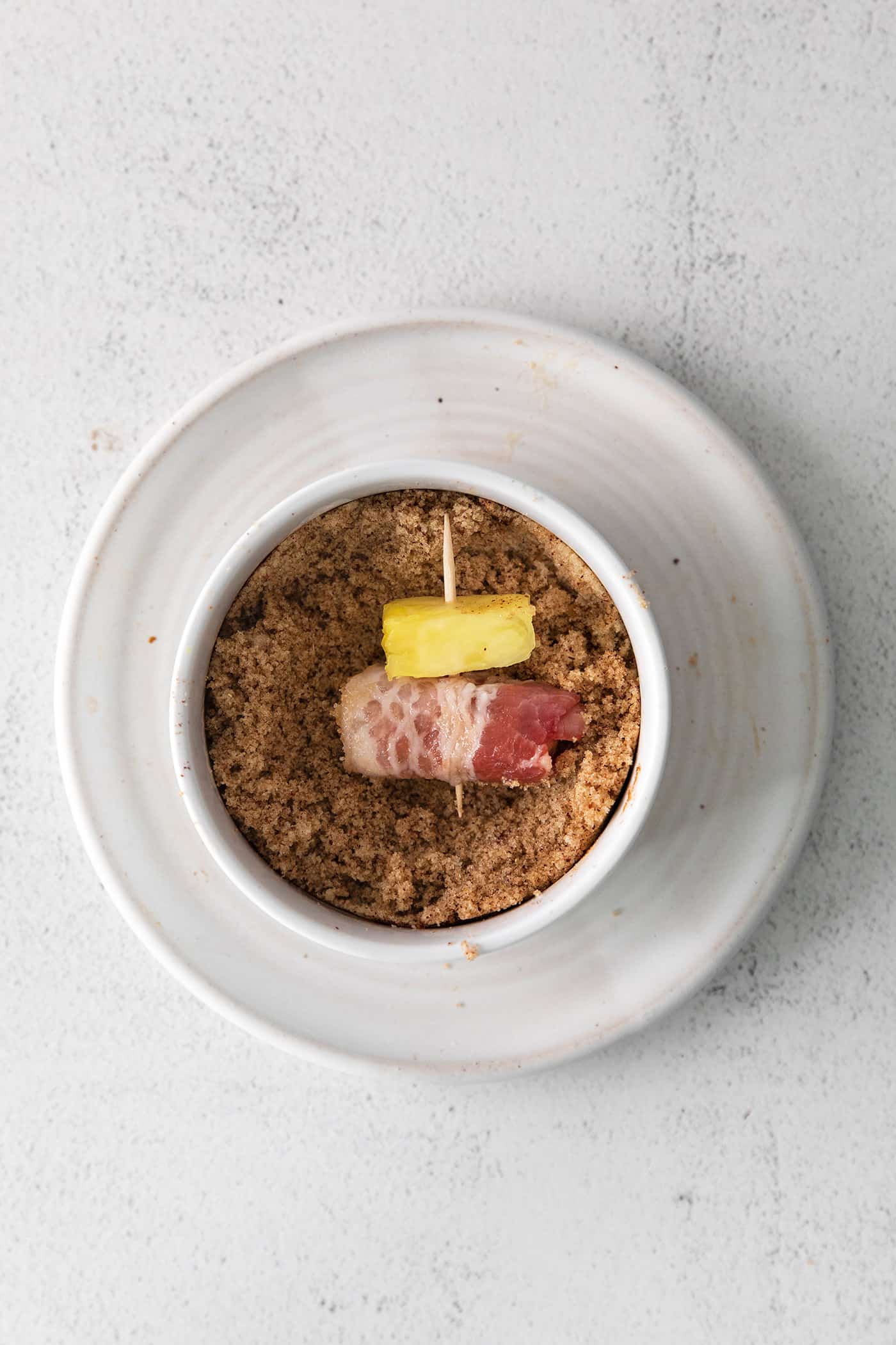 These Bacon Wrapped Smokies are the perfect game day appetizer. Switch things up by adding pineapple or jalapeno slices! A bacon wrapped little smokie with a pineapple dipped in brown sugar