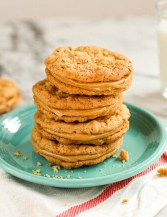 A stack of soft and chewy peanut butter sandwich cookies on a green plate