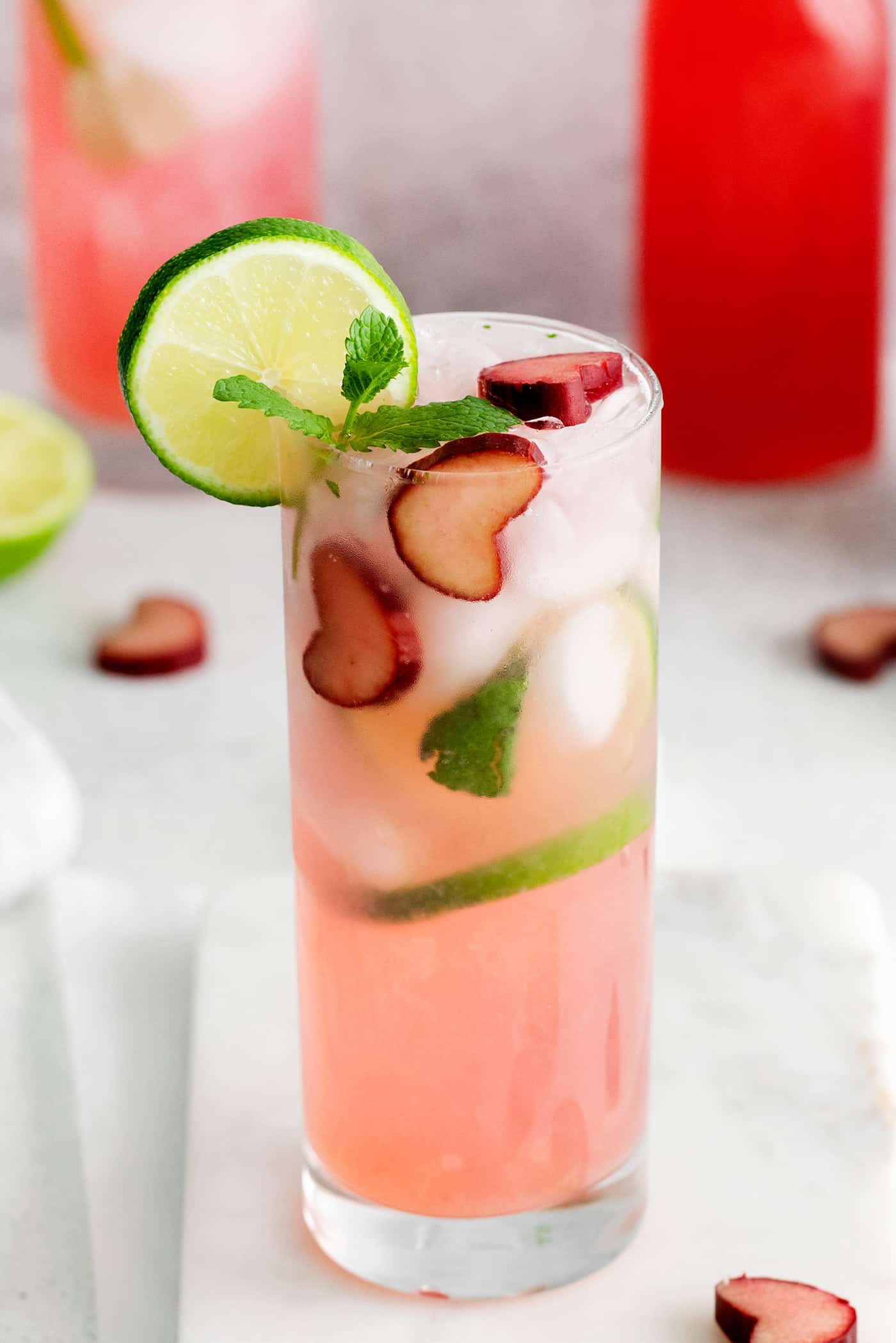 Relax by the pool this summer with a tall, cool Rhubarb Mojito. This twist on the classic cocktail is incredibly refreshing! A tall glass of rhubarb mojito