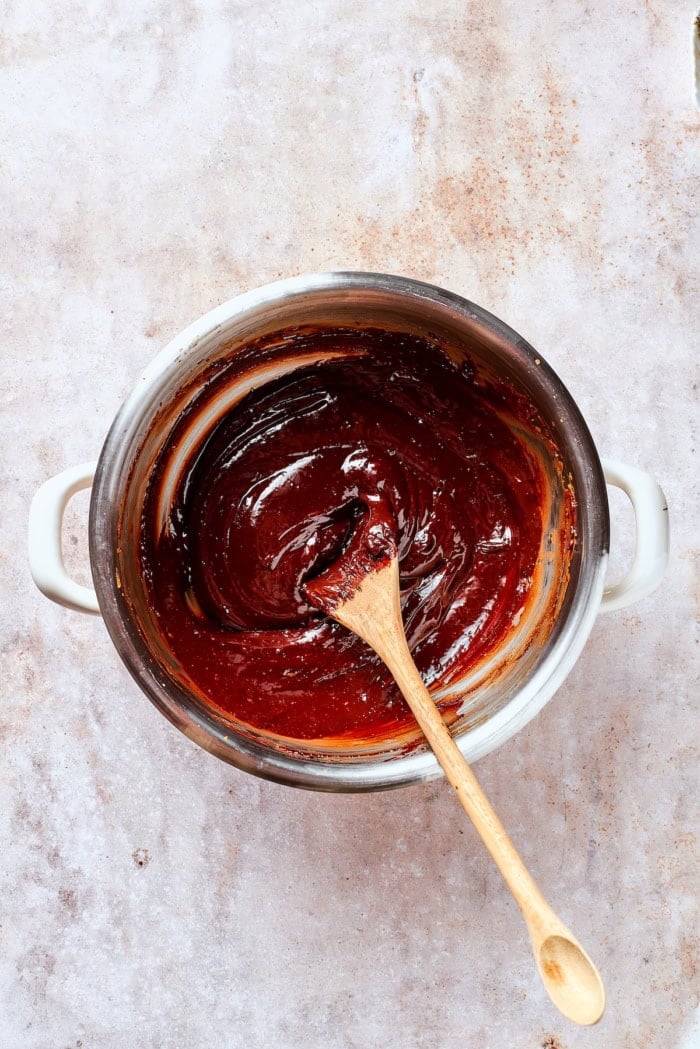 Chocolate and egg yolk mixture in double boiler.