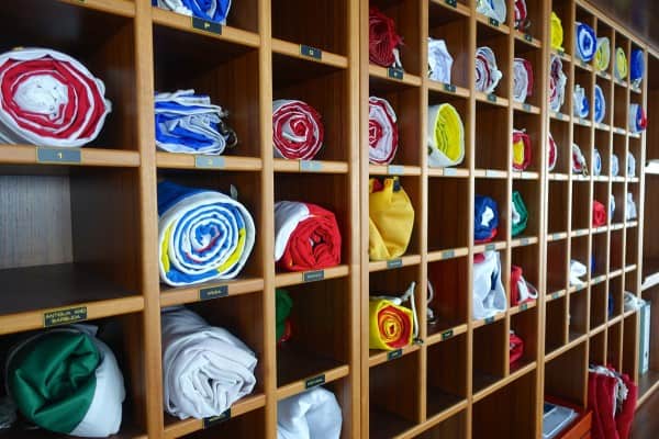 a wall of cubbies holding foreign country's flags