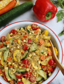 A bowl of quinoa salad with curry vinaigrette.