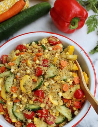 A bowl of quinoa salad with curry vinaigrette.