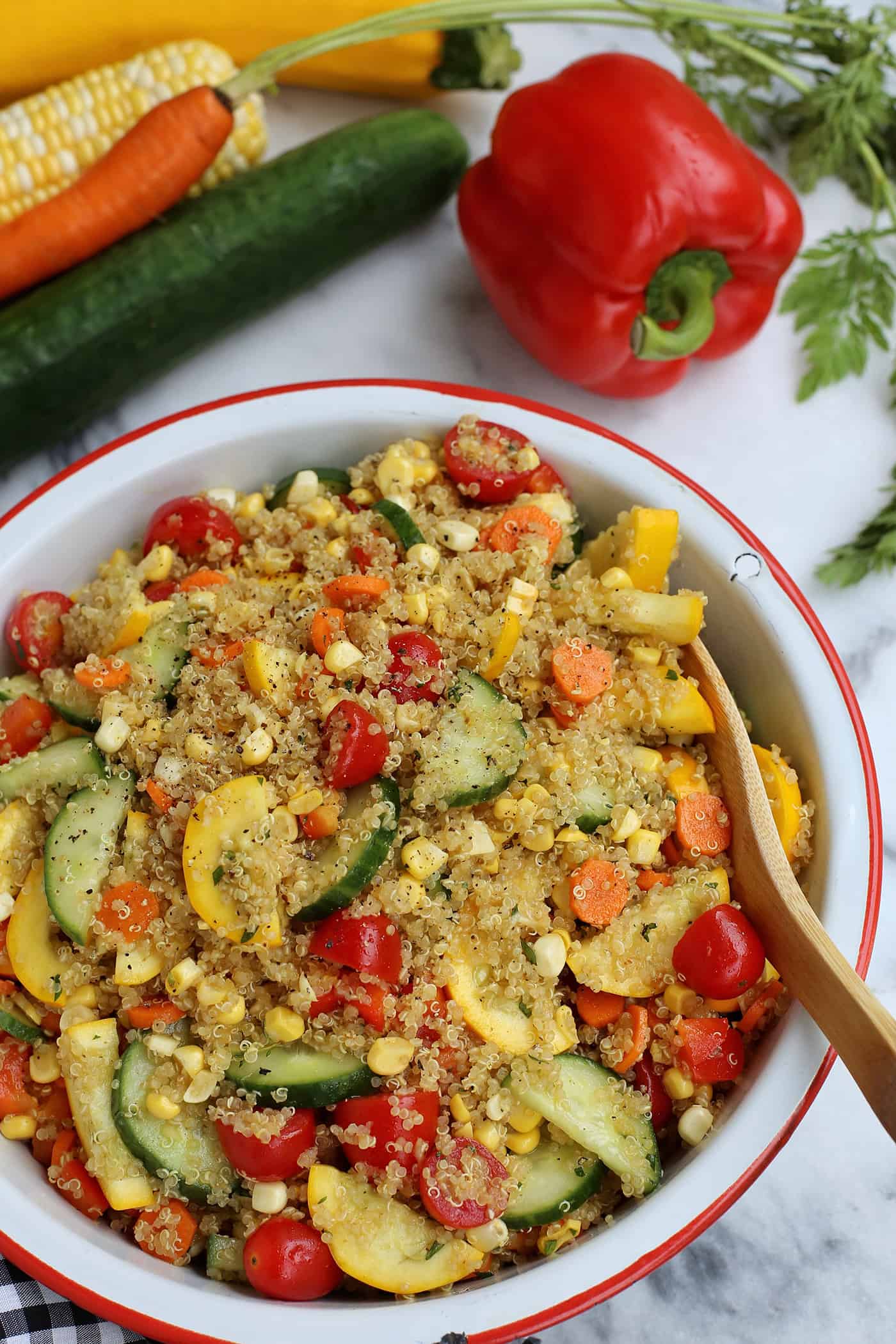 A bowl of quinoa salad with curry vinaigrette.