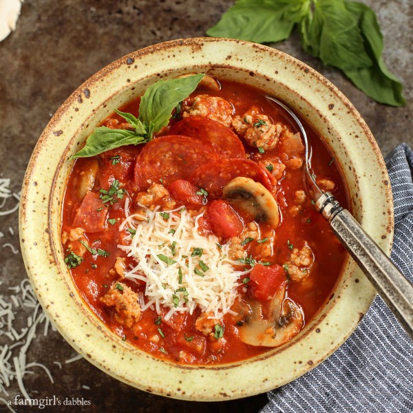 Cheesy Pizza Soup in a pottery bowl