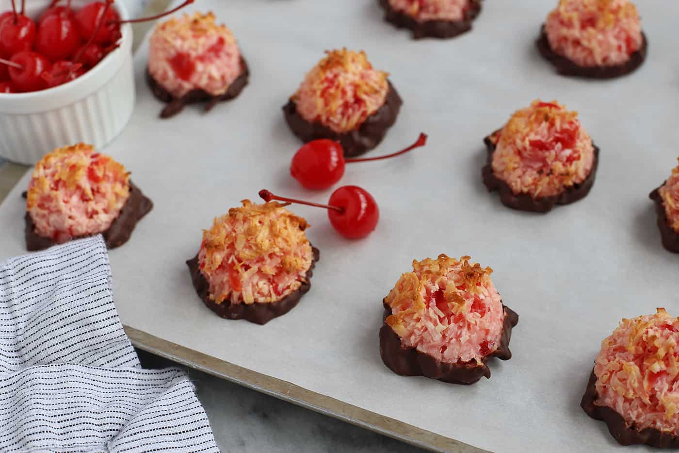 Cherry chocolate macaroons on a baking sheet