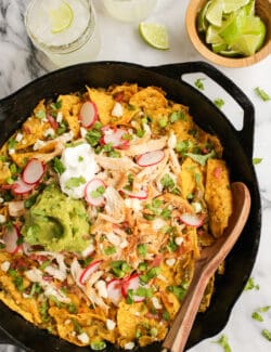 Overhead view of skillet chilaquiles verdes with chicken