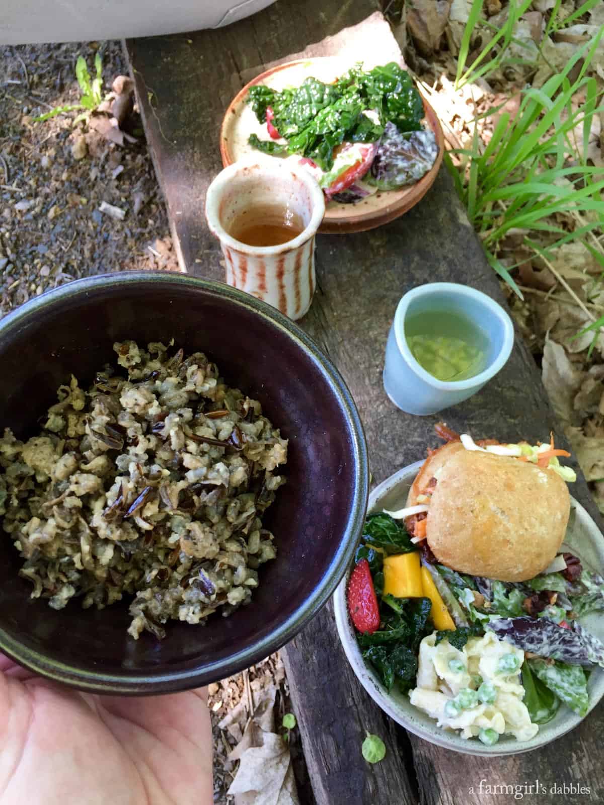 an outdoor lunch using handmade pottery