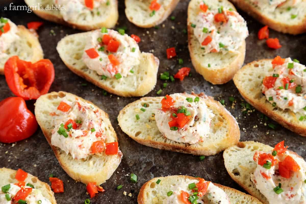 This ultra flavorful Creamy Shrimp and Peppadew Crostini recipe is perfect for any time of year, and especially festive during the holidays. Creamy Shrimp and Peppadew Crostini on a counter