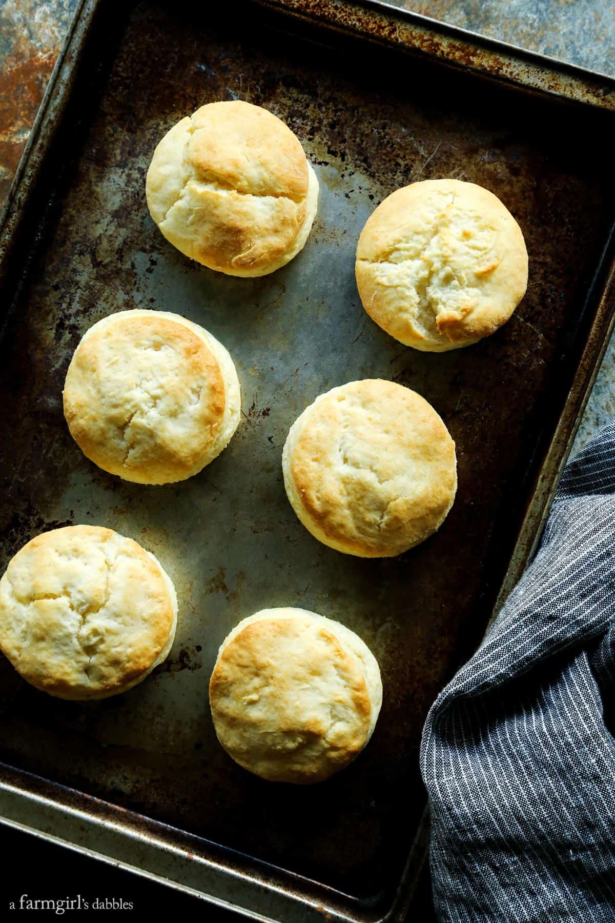 Smoked Turkey Pot Pie Soup is full of rich flavors and creamy comfort, and served with ultra-tender cream biscuits for dipping! Cream Biscuits on a baking sheet