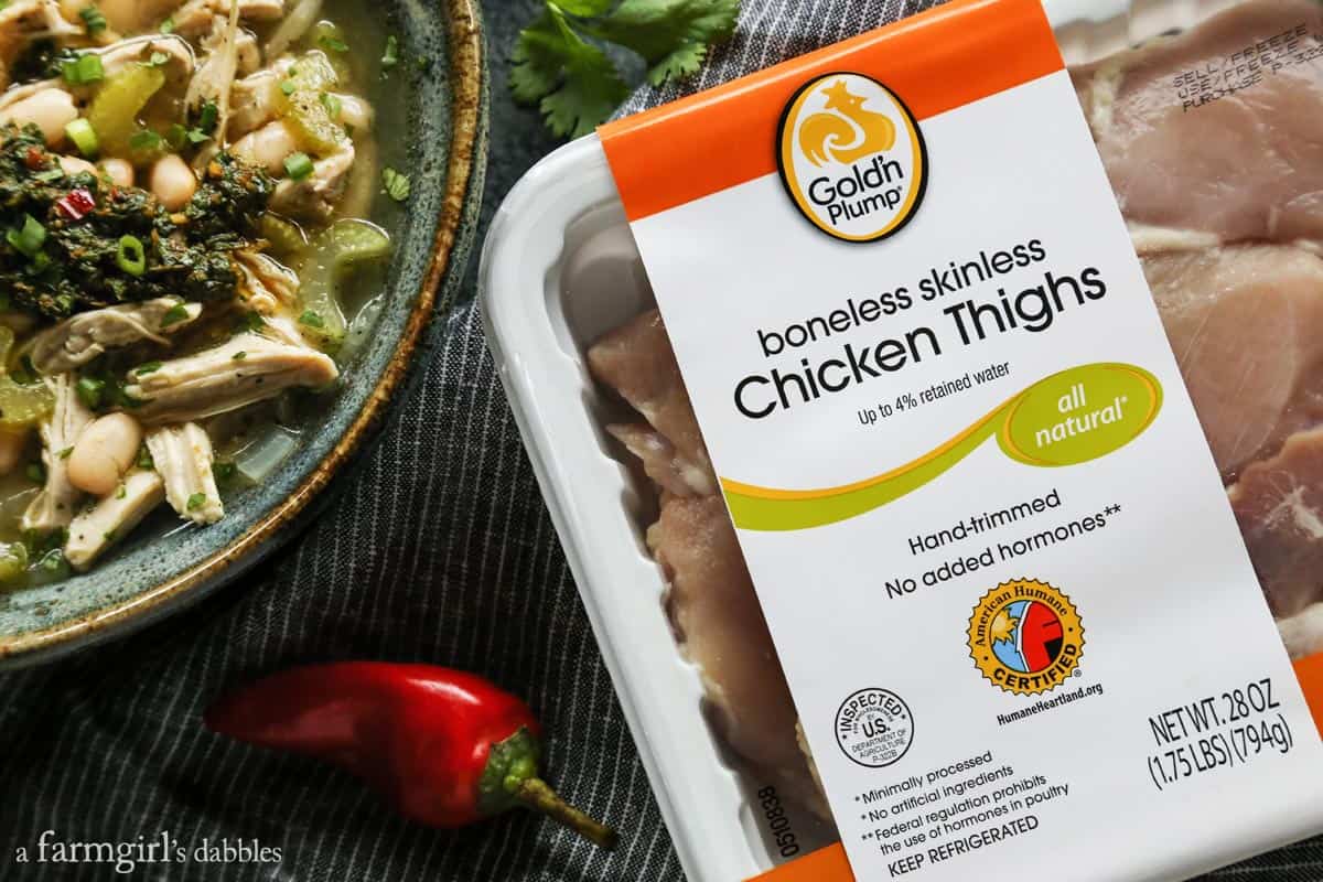 This herby chimichurri chicken soup recipe with creamy white beans is a hearty dinner with all the flavors of your favorite chicken soup. Chicken thighs for making chimichurri chicken soup.