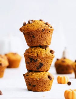 Three stacked muffins on the counter.