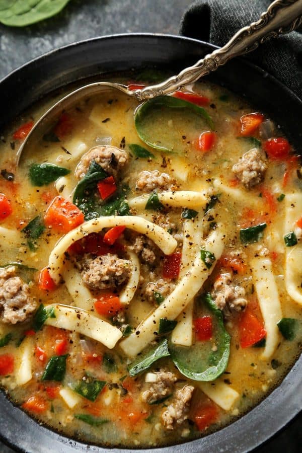 Hearty and satisfying, this Sausage and Red Pepper Soup with Egg Noodles is packed with comfort and delicious flavor! soup in a bowl
