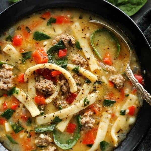 Hearty and satisfying, this Sausage and Red Pepper Soup with Egg Noodles is packed with comfort and delicious flavor! a bowl of Sausage and Red Pepper Soup with Egg Noodles