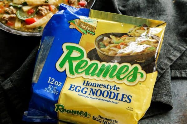 Hearty and satisfying, this Sausage and Red Pepper Soup with Egg Noodles is packed with comfort and delicious flavor! Reames homestyle egg noodles