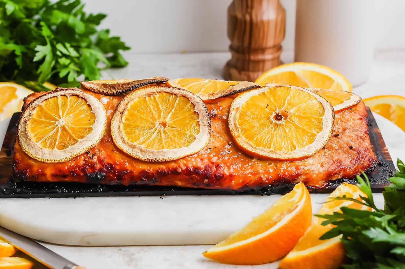 Grilled Chipotle-Orange Salmon is sweet, smoky and just a bit spicy, with irresistible caramelized edges. An easy recipe that feels special! Grilled chipotle-orange salmon on cedar plank