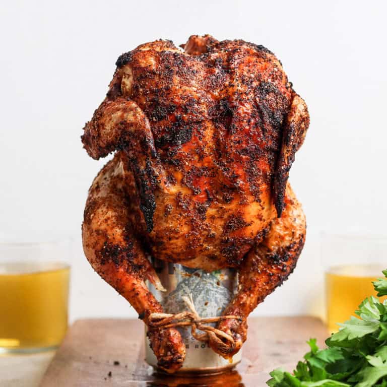 Cooked beer can chicken standing on can