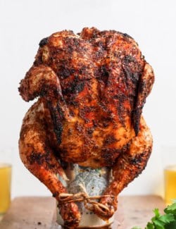 Cooked beer can chicken standing on can