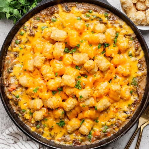 Overhead view of tater tot hotdish in cast iron skillet