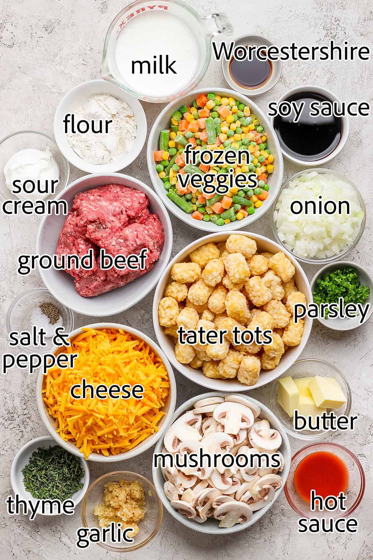 My easy made-from-scratch Tater Tot Hotdish is classic Minnesota comfort food — but fear not, I also share a canned soup version too! Overhead view of ingredients for tater tot hotdish with labels