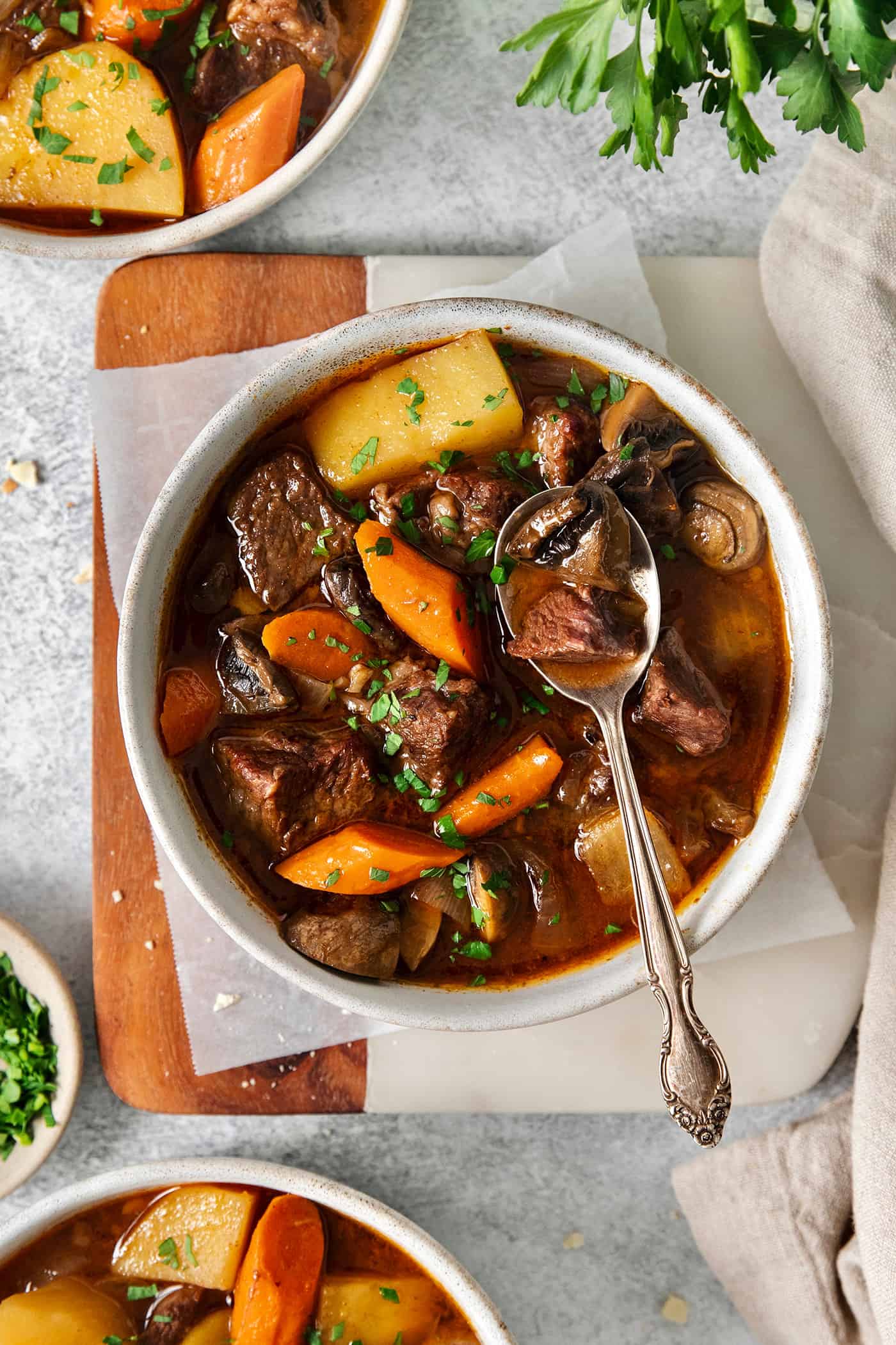 Slow Cooker Hungarian Goulash loaded with chunks of tender, melt-in-your-mouth beef and vegetables. Authentic, easy comfort food at its best! Overhead view of a bowl of Hungarian goulash