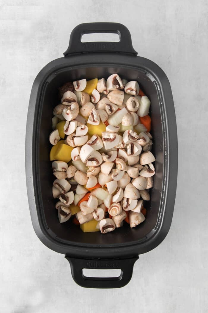 Slow Cooker Hungarian Goulash loaded with chunks of tender, melt-in-your-mouth beef and vegetables. Authentic, easy comfort food at its best! Chuck roast, potatoes, mushrooms, and carrots in a large slow cooker