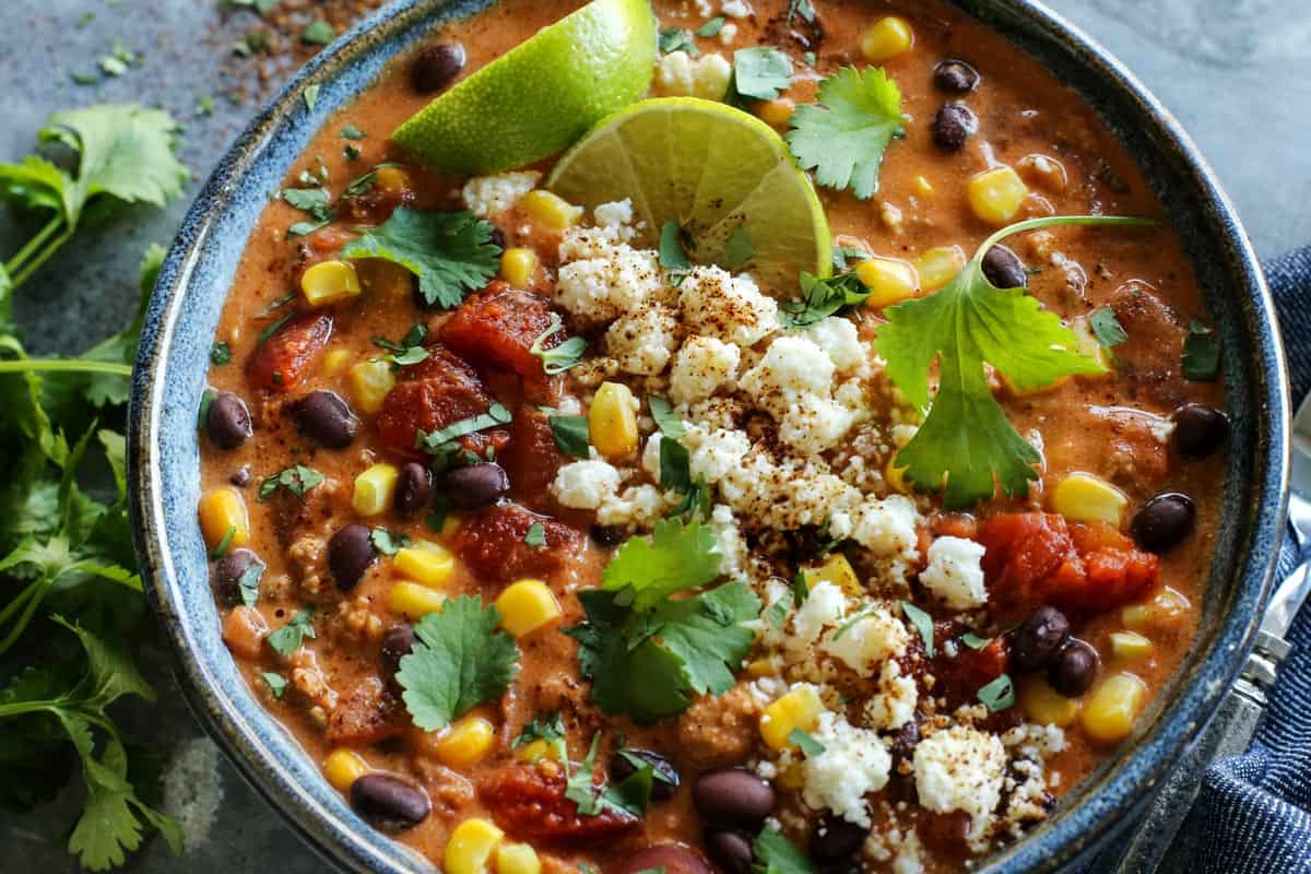 Creamy Enchilada Chili is brimming with tasty bites. In every spoonful, you'll savor the flavors of enchiladas...without tortillas! Creamy Enchilada Chili with fresh cilantro