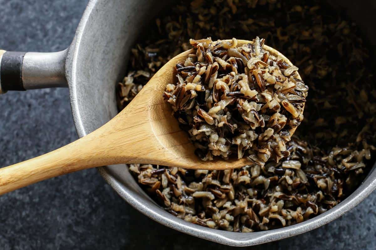 This creamy chicken wild rice casserole is easy comfort food loaded with veggies, melty gruyere cheese, and a buttery crouton topping! wild rice