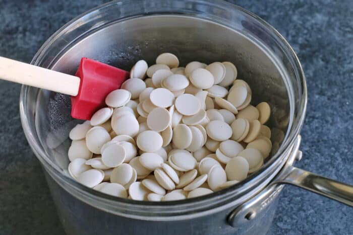 Creamy, minty peppermint bark is easy to make for the holidays with only 3 ingredients! This Christmas candy bark makes a great edible gift. White candy melts in a double boiler