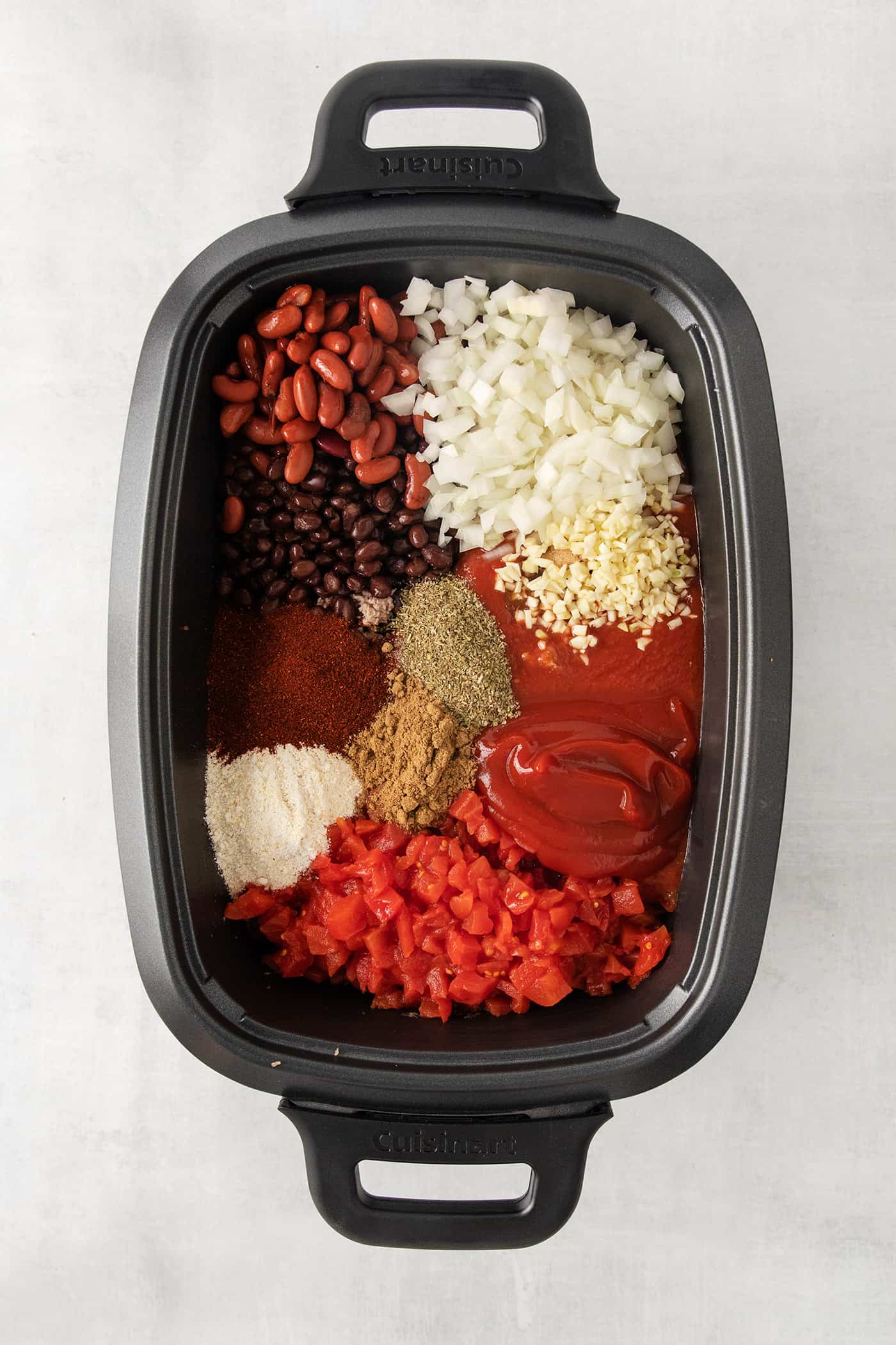 This Slow Cooker Chili recipe has been in my family for years! It's an easy, homemade chili cooked in the crockpot & packed with flavor. Chili ingredients in the crockpot