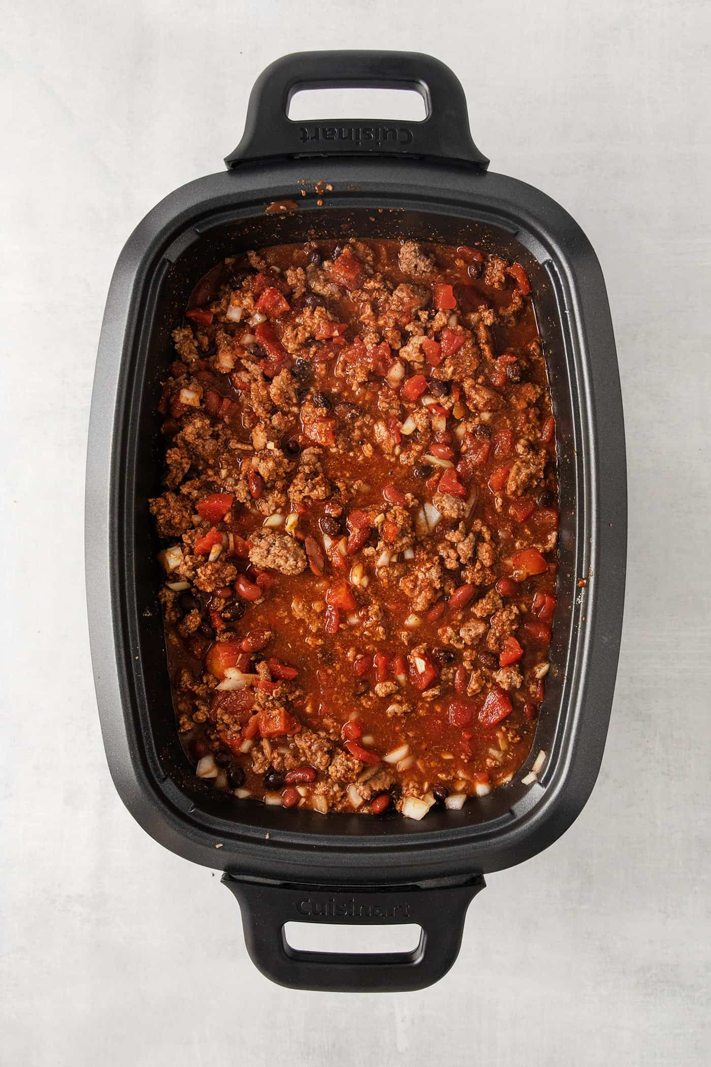 This Slow Cooker Chili recipe has been in my family for years! It's an easy, homemade chili cooked in the crockpot & packed with flavor. Beef chili in the slow cooker