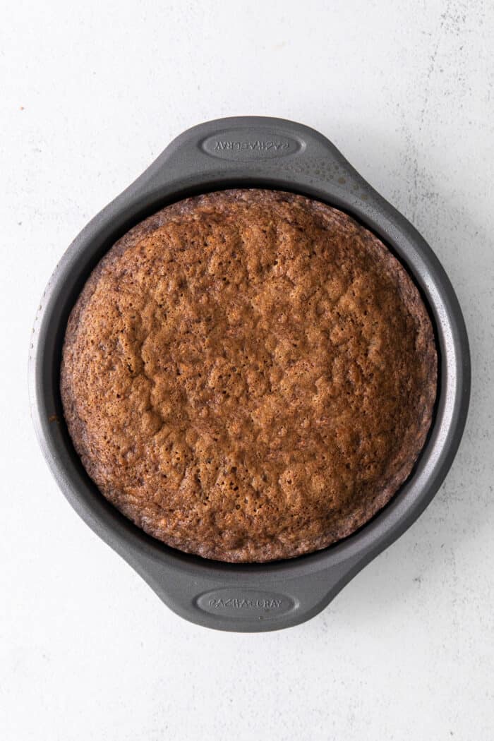 This classic carrot cake recipe is moist, perfectly spiced, and baked in a single layer, topped with creamy homemade cream cheese frosting. Carrot cake in a round cake pan
