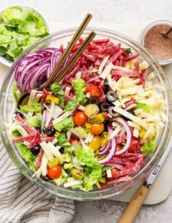Overhead view of Italian chopped salad in glass bowl