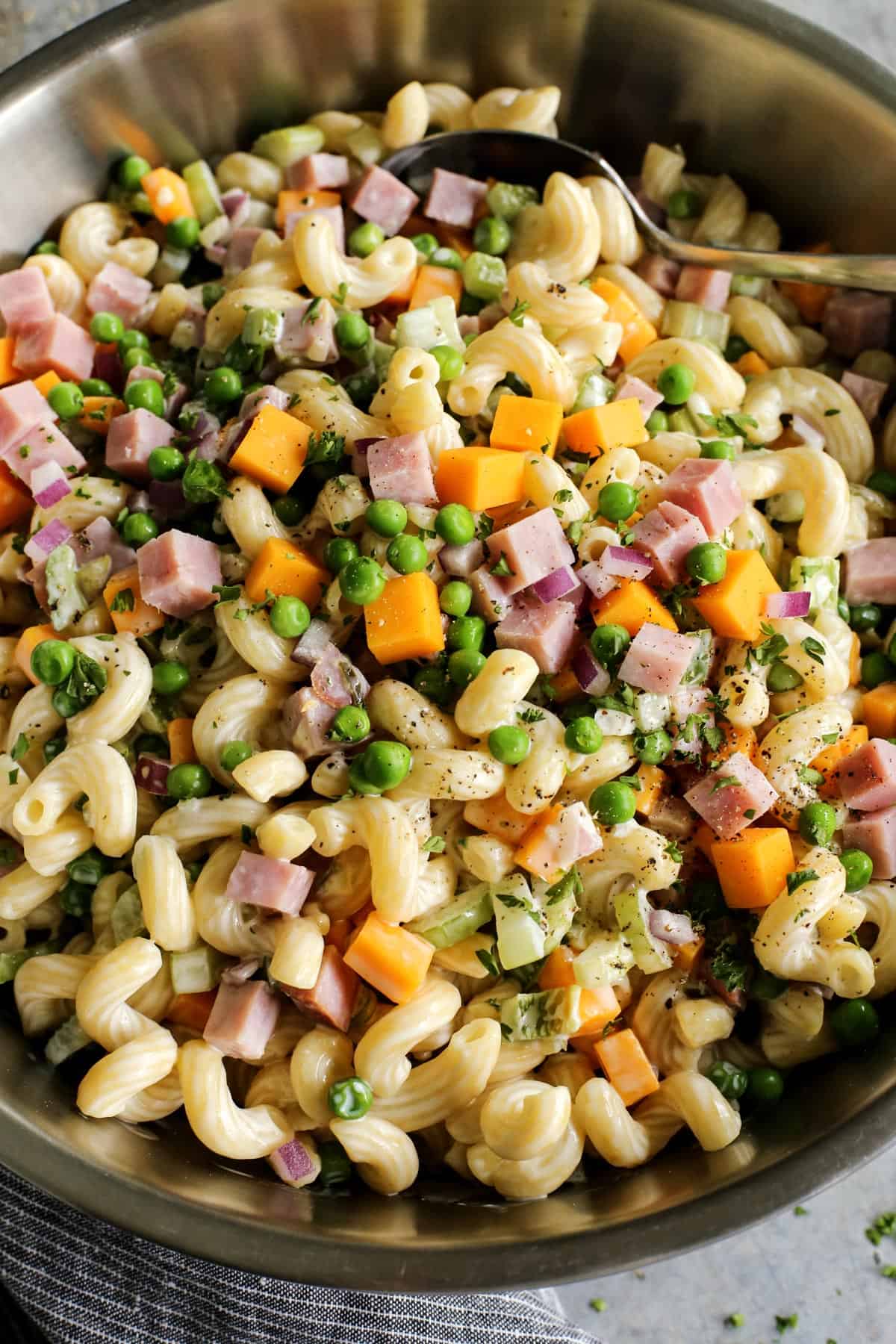 Hearty macaroni salad with ham in a bowl. 