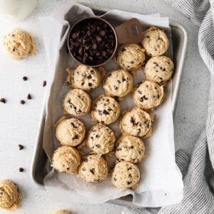 Overhead view of scoops of edible chocolate chip cookie dough on a tray