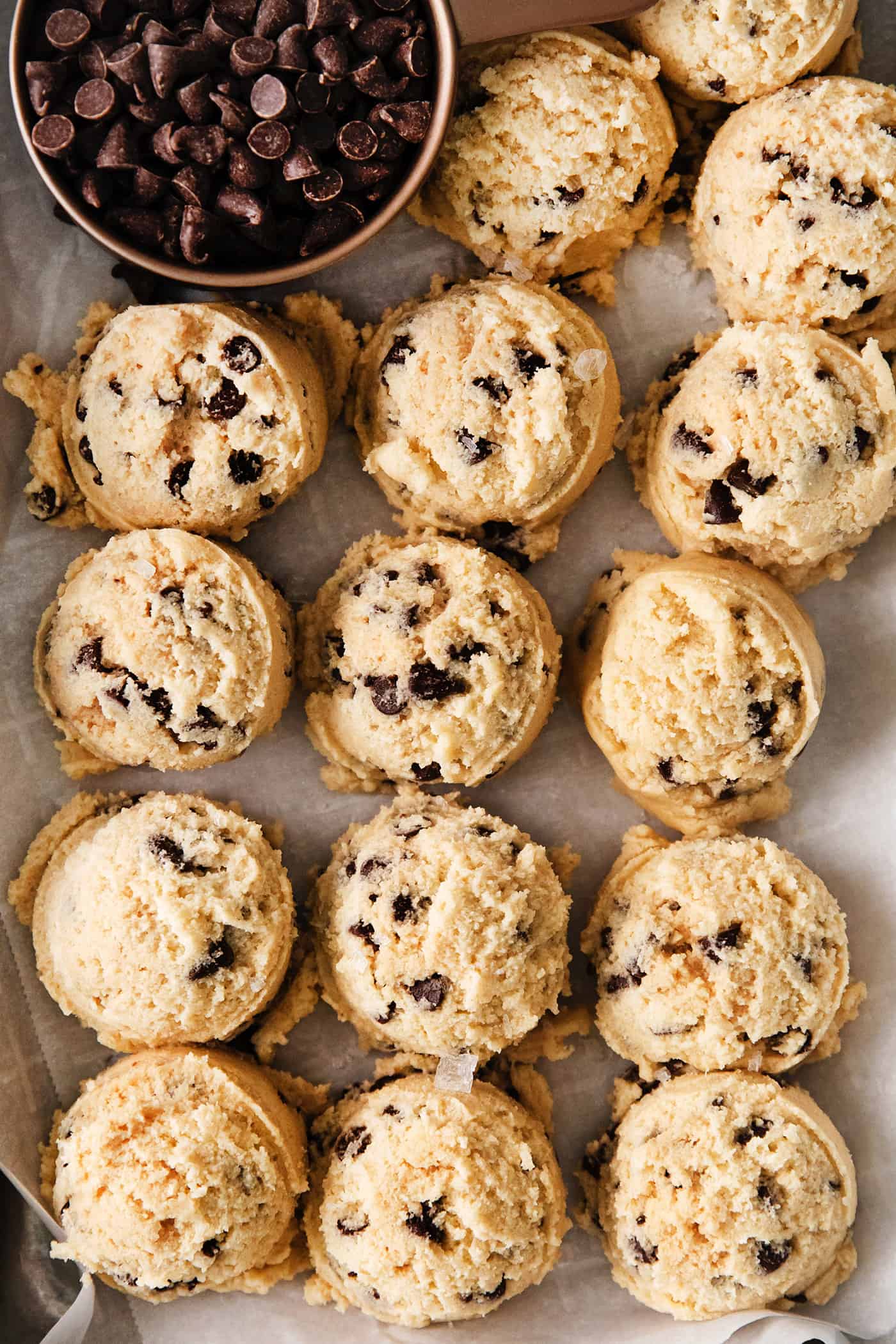 An easy edible cookie dough recipe that's egg-free and made with heat-treated flour so it's safe to eat. Refrigerate or freeze it for later! Close-ups of scoops of eggless cookie dough