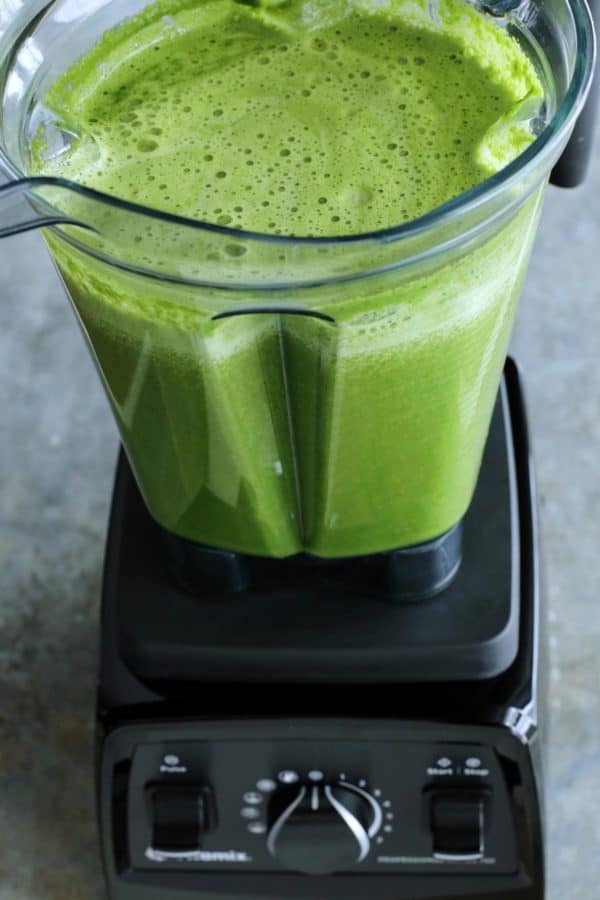 Green Juice is an easy blender recipe that whirls together spinach, parsley, cucumber, celery, green bell pepper, and orange juice. green juice blended in blender pitcher
