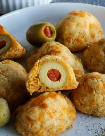 baked olive cheese balls on a plate