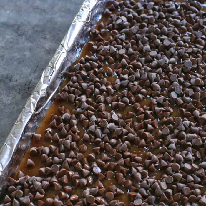 Chocolate chips on top of hot toffee