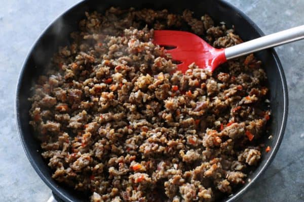 With Italian sausage, cream cheese, Parmesan, and mozzarella, these easy stuffed jalapeños are extra cheesy with the perfect amount of heat! Italian sausage browned in a skillet