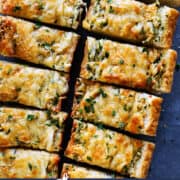 Pinterest title image for Cheesy Garlic Bread.