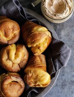 basket of popovers and a jar of cinnamon honey butter