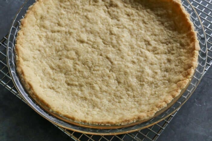 This Strawberry Cream Cheese Pie piles a fluffy cream cheese layer on a crisp shortbread cookie crust along with a fresh strawberry topping. a baked press-in shortbread pie crust